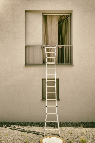 Ladder on open window stock photo