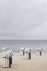 Germany, Timmendorf Beach with hooded beach chairs - ASCF000573