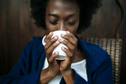 Woman's hands holding cup of coffee, close-up stock photo
