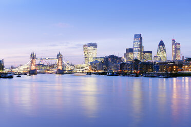 UK, London, skyline with River Thames and Tower Bridge at blue hour - BRF001346