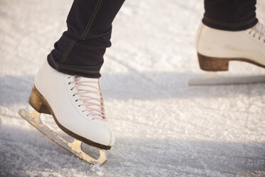 Close-up of woman ice skating - ZOCF000081