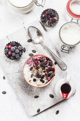 Bowl of vegan coconut yogurt with berries, puffed amaranth, pumpkin seeds and raspberry pulp - SBDF002792