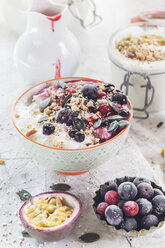 Bowl of vegan coconut yogurt with berries, puffed amaranth, pumpkin seeds and raspberry pulp - SBDF002795