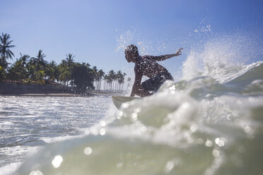 Indonesia, Bali, surfer on wave - KNTF000277