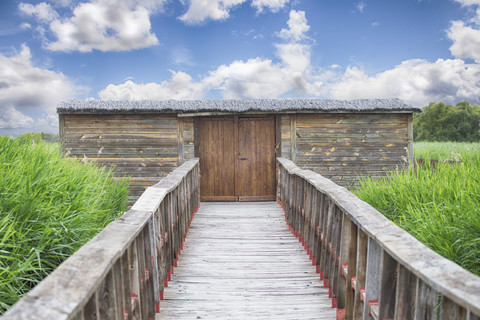 Spain, Ciudad Real, wooden bridge and old wooden house stock photo