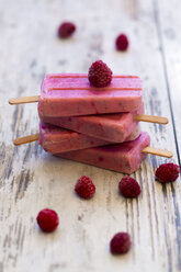 Stack of homemade raspberry ice lollies - SARF002714