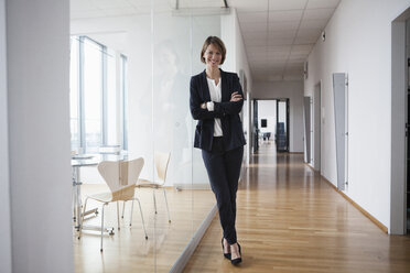 Portrait of confident businesswoman in office hall - RBF004442