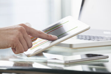 Close-up of woman's hands using digital tablet - RBF004522