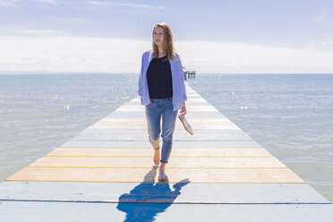 Young woman walking on jetty - BOYF000332