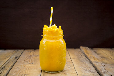 Glass of mango smoothie garnished with diced mango - LVF004838
