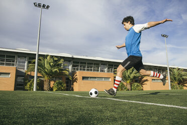 Football player kicking a ball - ABZF000446