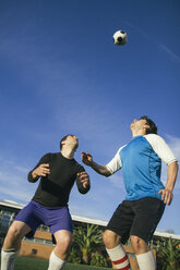 Two football players about to head the ball - ABZF000462