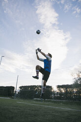 Goalkeeper trying to catch football - ABZF000471