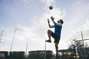 Goalkeeper trying to catch football - ABZF000472