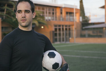 Goalkeeper holding a football - ABZF000478