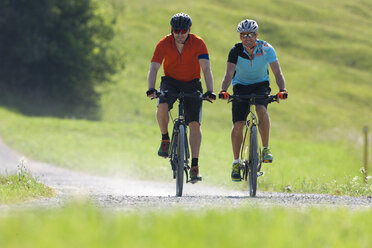 Two men on a bicycle tour with trekking bikes - DSF000661