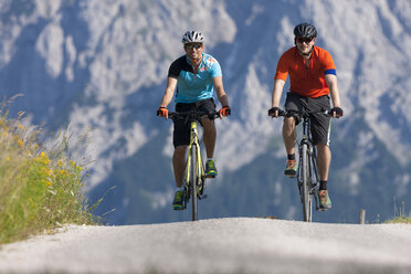 Two men on a bicycle tour with trekking bikes - DSF000665