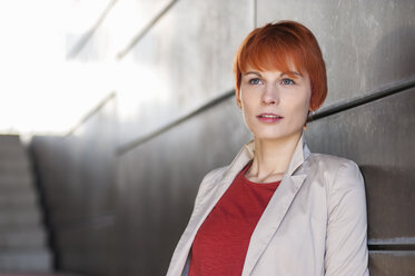 Portrait of redheaded young woman thinking - DIGF000433