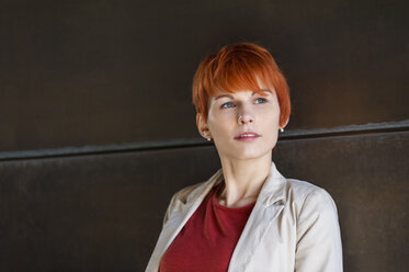 Portrait of redheaded young woman thinking - DIGF000435