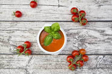 Tomato soup and tomatoes on wood - LVF004845