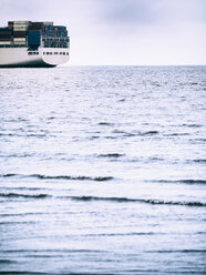 Germany, near Cuxhaven, North Sea, loaded container ship, stern - KRPF001747