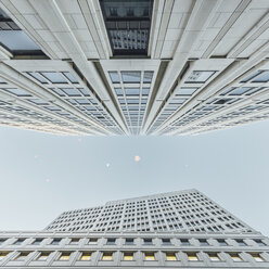 Germany, Berlin, flying heart-shaped balloons between two skyscrapers seen from below - ZMF000470