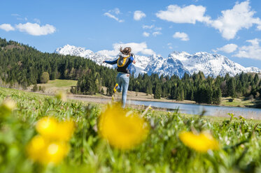 Germany, Bavaria, carefree woman at lake Barmsee - DIGF000481