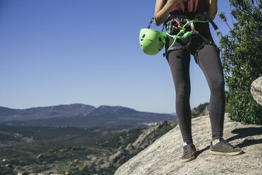 Legs of a climber woman with climbing equipment - ABZF000489