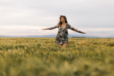 Woman dancing on a field - JPF000147