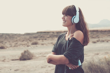 Young woman listening music, smiling happily - SIPF000488