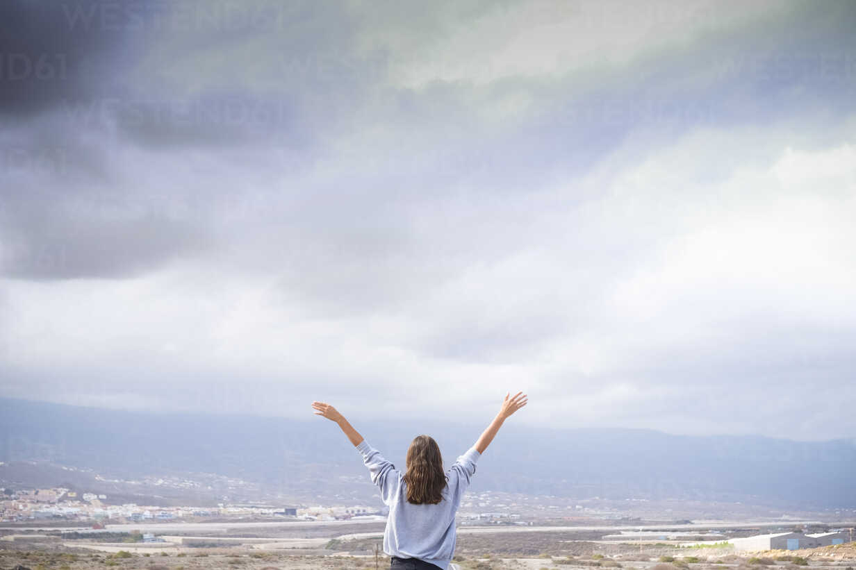 A Young Woman With Arms Stretched Out To The Sky Stock Photo, Picture and  Royalty Free Image. Image 11465876.