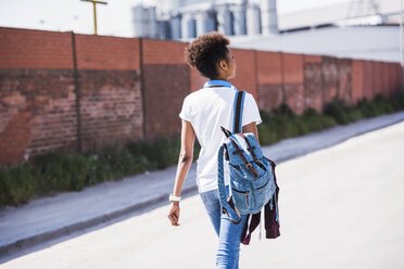 Young woman walking outdoors - UUF007309