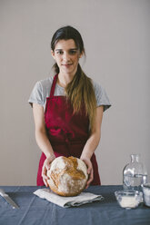 Woman with hand made bread - EBSF001393