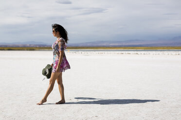 Chile, San Pedro de Atacama, woman walking in the desert - MAUF000600