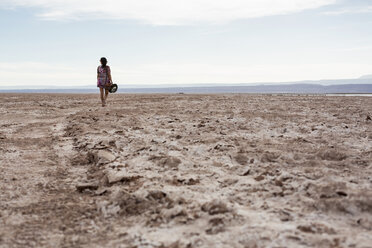 Chile, San Pedro de Atacama, woman walking in the desert - MAUF000607