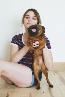 Young woman with her dog - RTBF000214