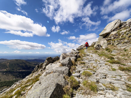 Spain, Sierra de Gredos, man hiking in mountains - LAF001639