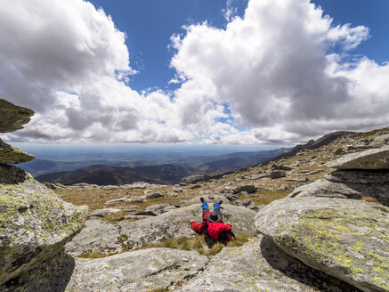 Spain, Sierra de Gredos, hiker sitting in mountainscape - LAF001644