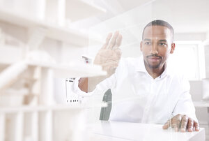 Man using transparent touchscreen display - MFRF000681