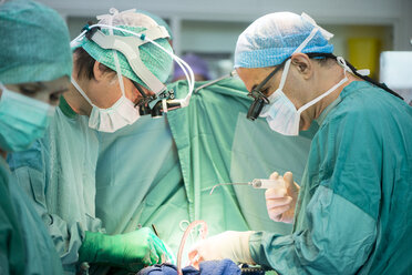 Heart surgeons during a heart operation - MWEF000044