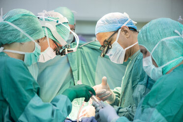 Heart surgeons during a heart operation - MWEF000045