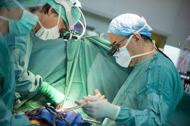 Heart surgeons during a heart operation - MWEF000046