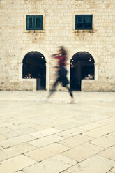 Croatia, Dubrovnik, person walking on Stradun - ZEDF000148