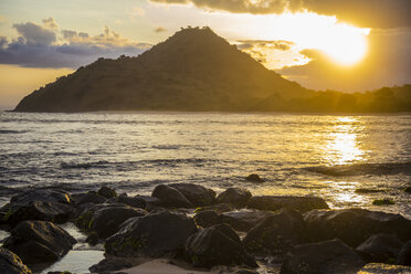 Indonesia, Coastline of Sumbawa island at sunset - KNTF000285