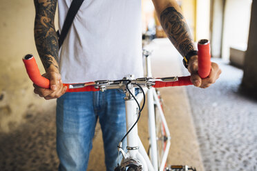 Young man with a bicycle in the city - GIOF001164