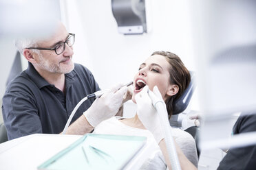 Young woman getting dental treatment - FMKF002649