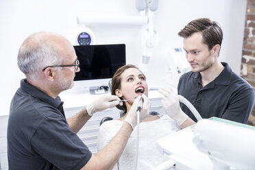 Young woman getting dental treatment - FMKF002650