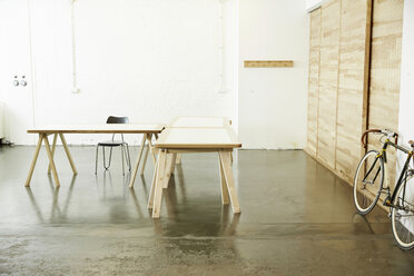 Desks and racing cycle in a studio - TSFF000061