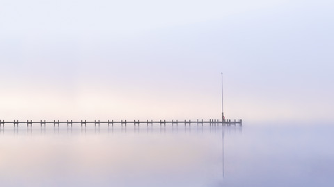 Lake Starnberg, wooden pier at dawn stock photo