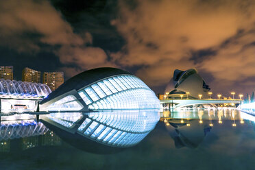 Spain, Valencia, lighted L'Hemisferic and Palau de les Arts Reina Sofia at City of Arts and Sciences by night - PUF000514